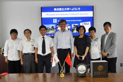 Commemorative Photo: Dr. Ying Zhang, the right next to Pres. Hasebe (Center) is YNU alumna. 