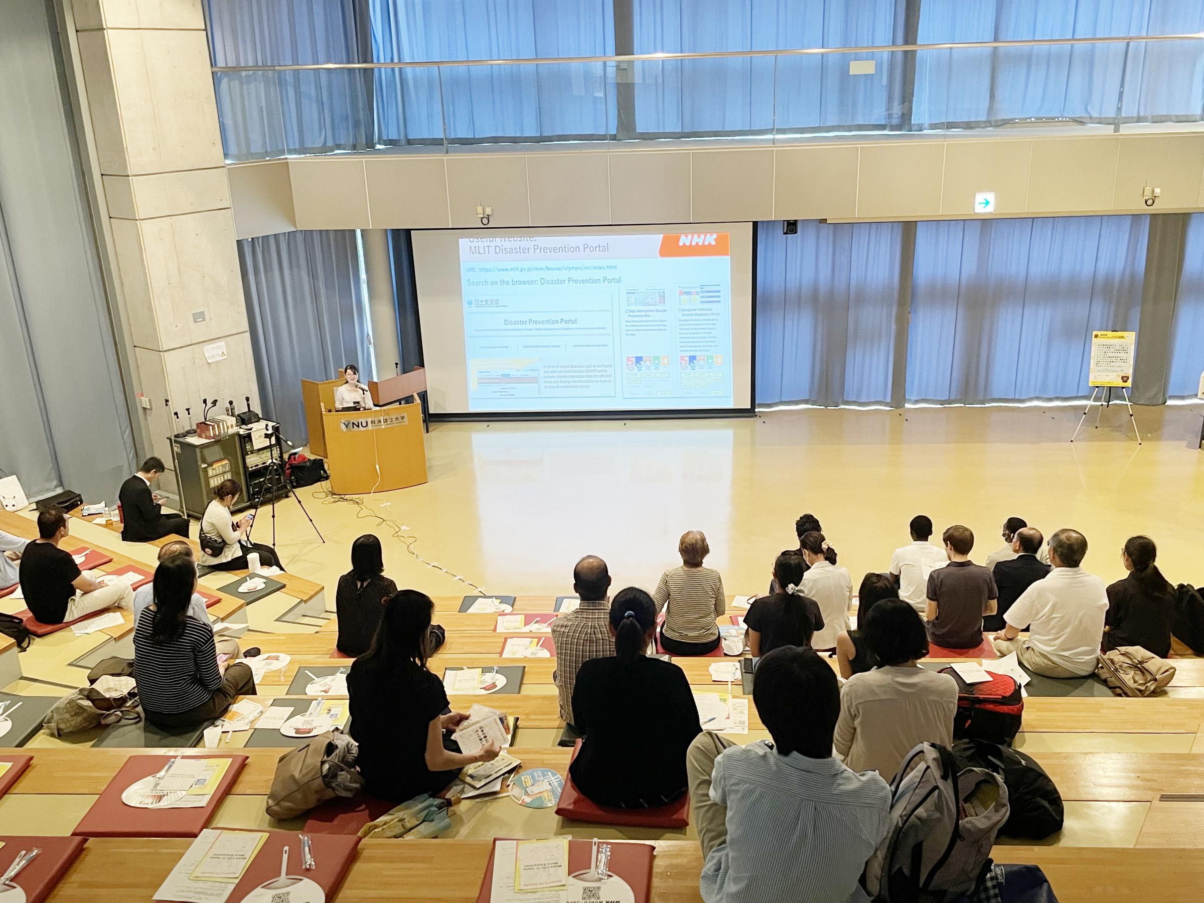 Participants listen to Mr. Uchida's explanation