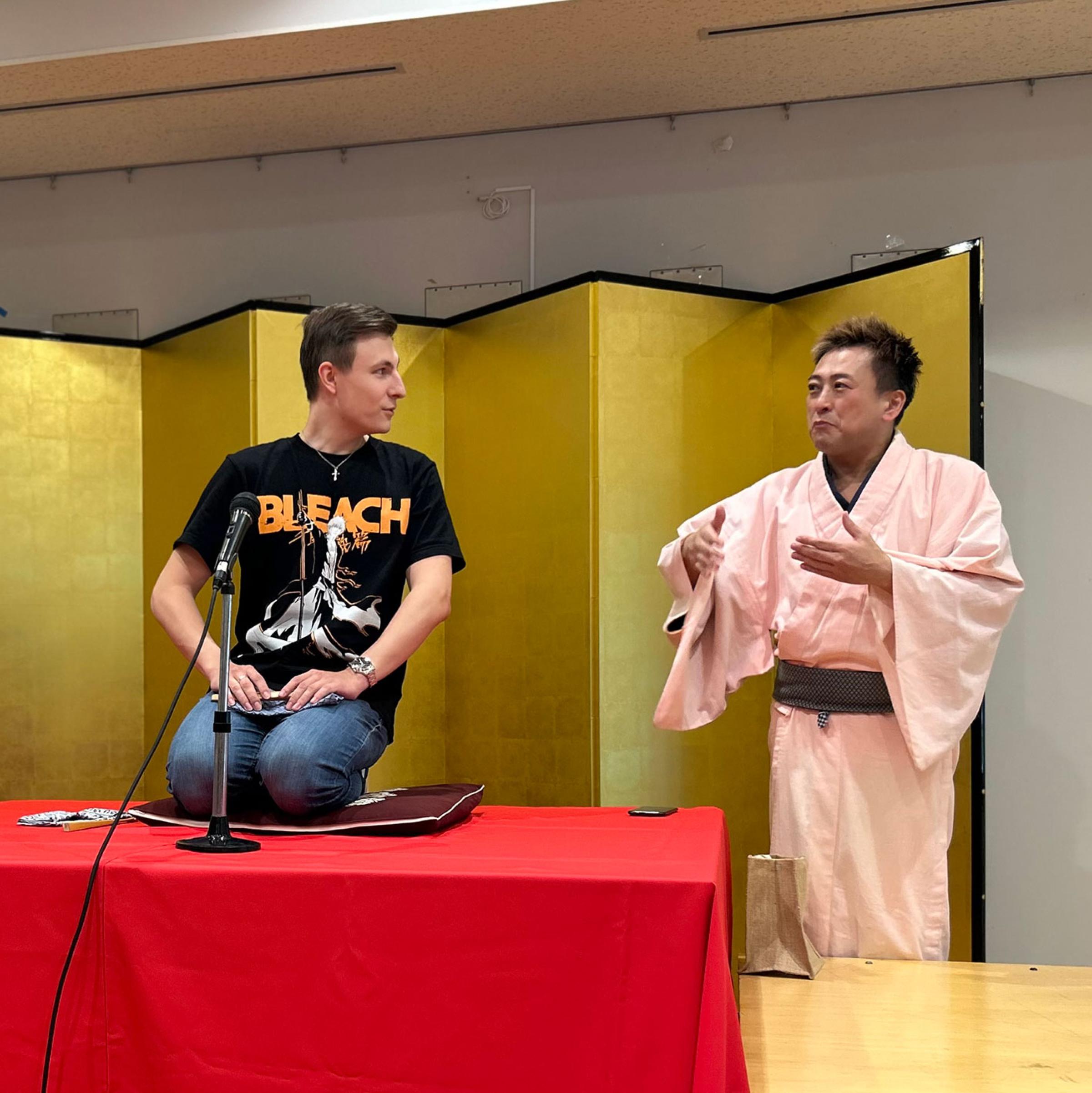 International student enthusiastically performing with Mr. Kimochi