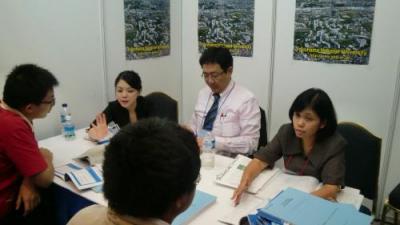 YNU staff speaking to visitors, Jakarta