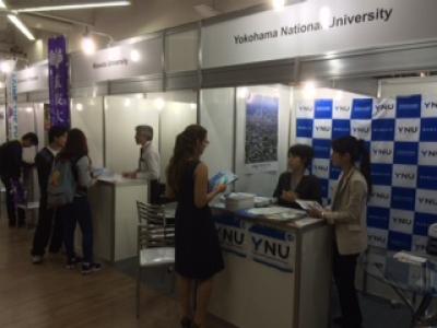 A student asking questions at the YNU booth