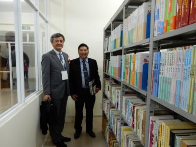 In Front of the Bookshelf of Japanese Language Given by YNU, with Rector Nguyen Manh Toan, DUE