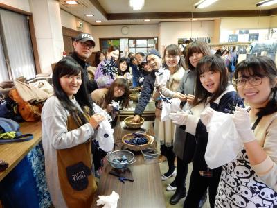 Holding white cloth before dyeing