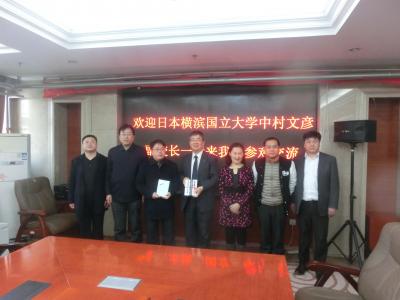 (3rd from the left) the Principal of the High School Affiliated to Minzu University