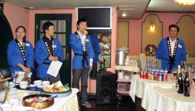 Former students making their speech in blue happy coats